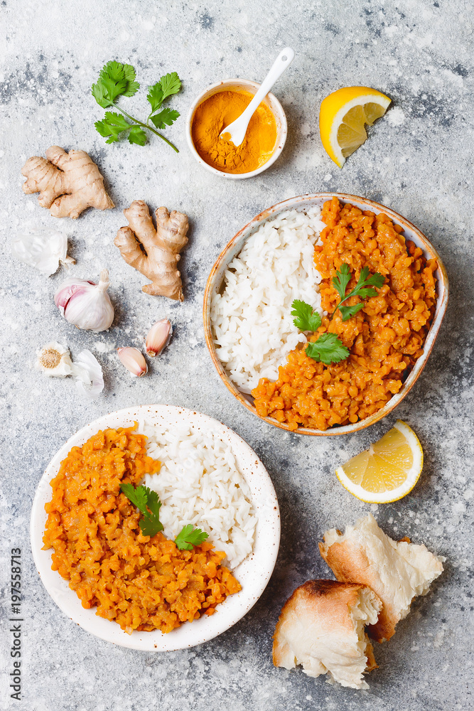 Traditional red lentil Dal. Indian Dhal spicy curry in bowl with flat bread and spices. Top view, overhead Traditional red lentil Dal. Indian Dhal spicy curry in bowl with flat bread and spices. Top view, overhead