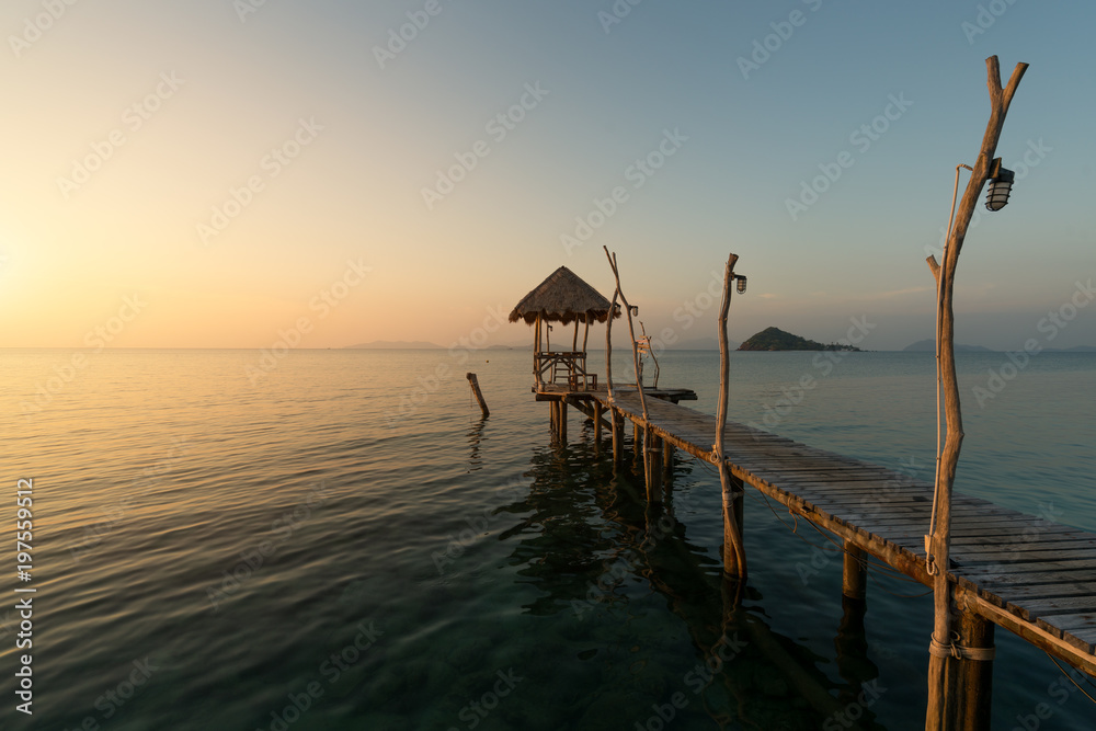 Wooden pier between sunset in Phuket, Thailand. Summer, Travel, Vacation and Holiday concept.