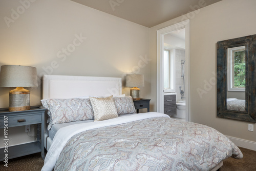 Bedroom with peak in bathroom
