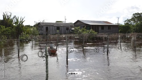 Child navigating in the amazonian river, Amazonas, Brazil.