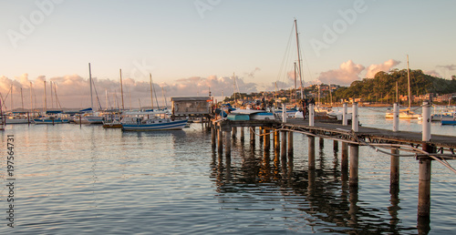 Sunset with Sailboats anchored in the pier