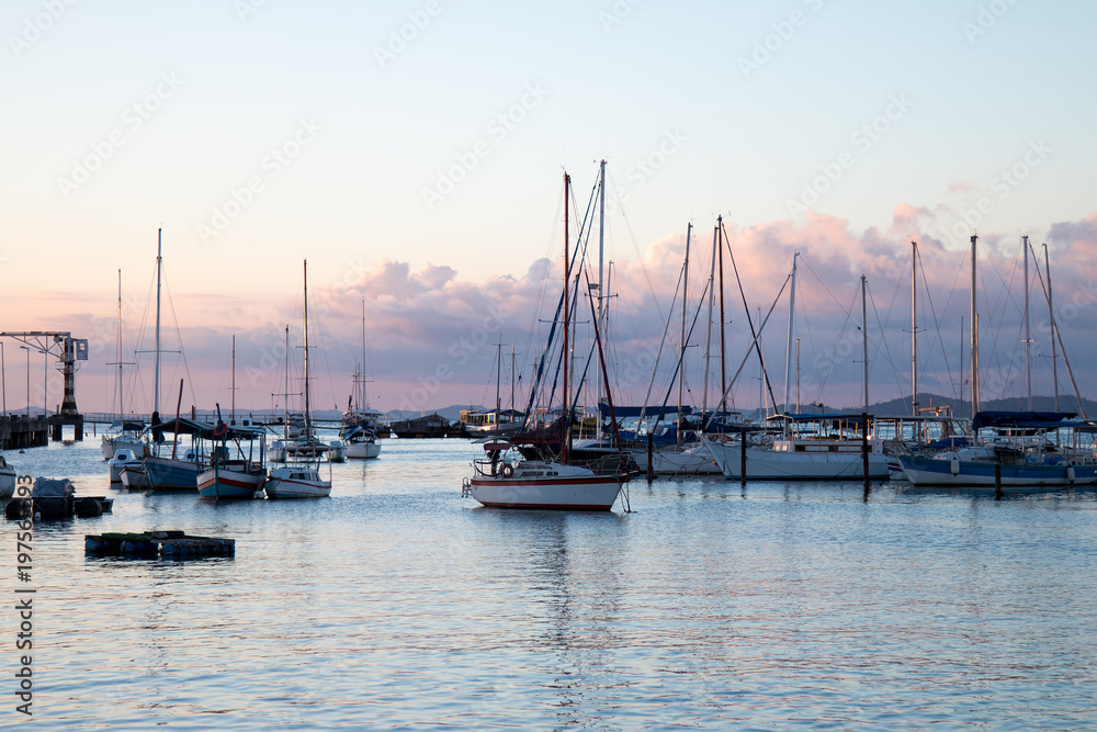 Sunset with Sailboats anchored in the pier