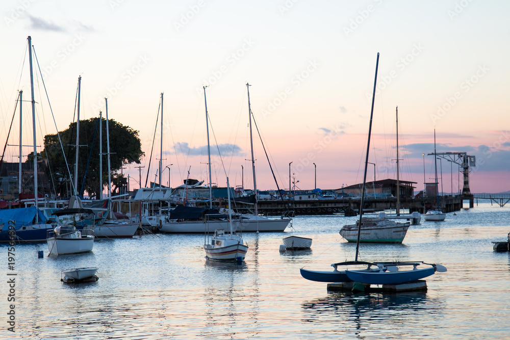 Sunset with Sailboats anchored in the pier