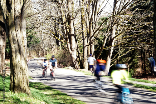 Blurred motion of bicyclist on a spring day photo