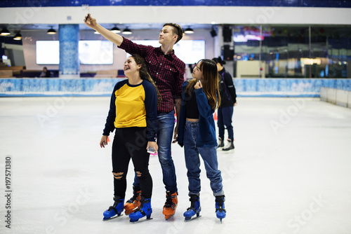 Teenage selfie together at ice skate