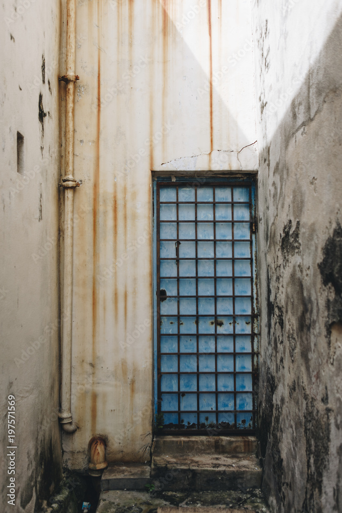 Fototapeta premium Rustic door and exterior of a house in Penang