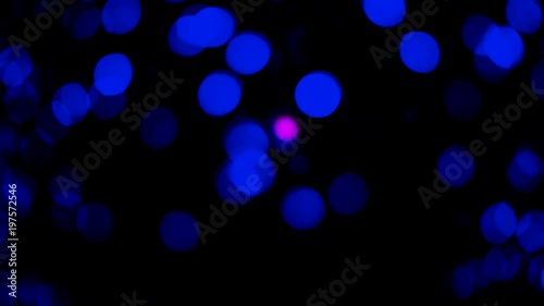 Movement of blurred lights in the darkness of the night