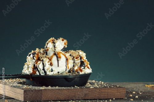 Piece of chocolate almond cornmeal cake with balsamic drizzle and ice cream photo