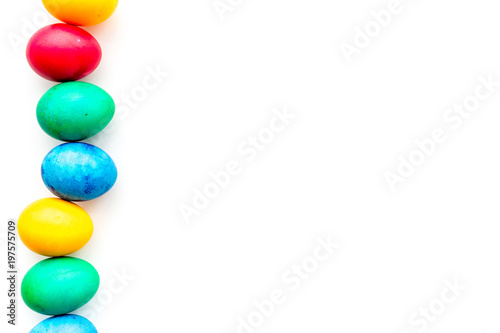 Colorful easter eggs on white background top view mockup