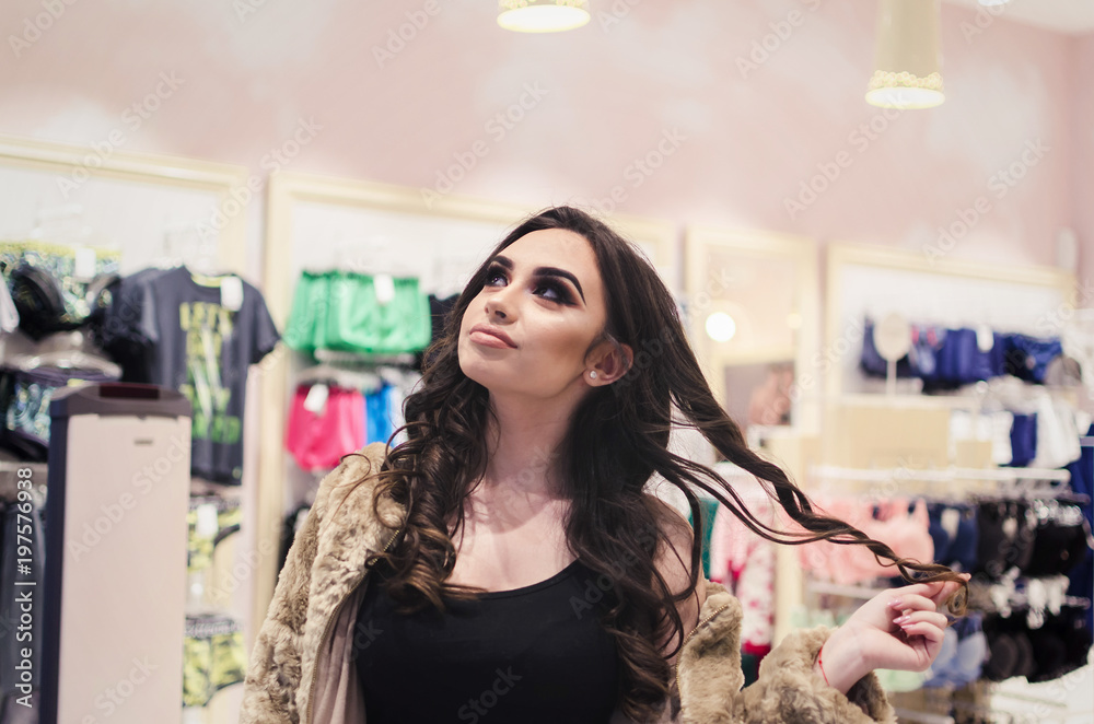 Girl thinking what she can buy for boyfriend birthday, Girl at a Men's Shop Girl thinking what she can buy for boyfriend birthday, Girl at a Men's Shop