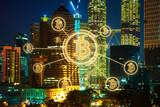 Bitcoins and blockchain network connection with night city background .Electronic money ,blockchain transfers and finance concept.