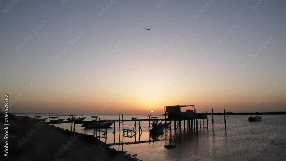 Arab Fishermen House at Sunset and an Airplane Arab Fishermen House at Sunset and an Airplane