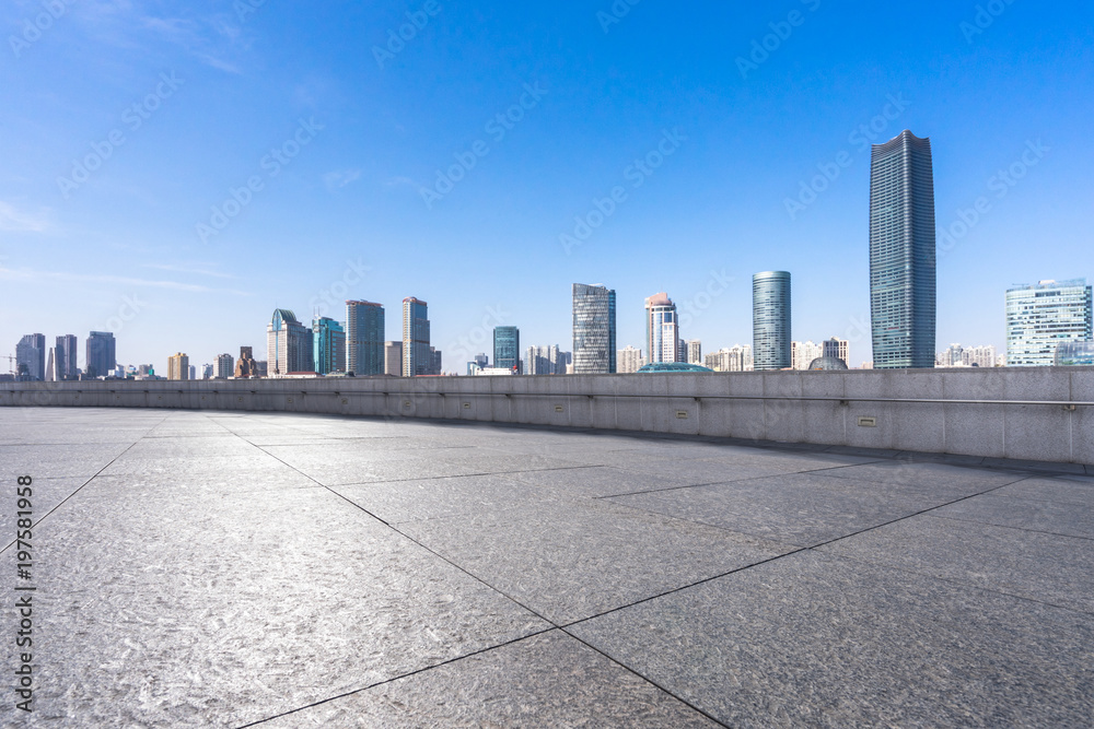 empty floor with modern building in urban empty floor with modern building in urban