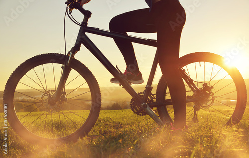 Cyclist on a bicycle in the sunset. Healthy lifestyle concept.