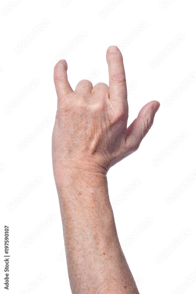Hand of senior woman showing devil horns sign Hand of senior woman showing devil horns sign
