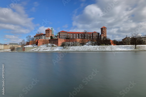 Wawel castle in winter, Vistula river in foreground, long exposure, Krakow, Poland