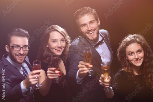 happy young people with a glass of wine.