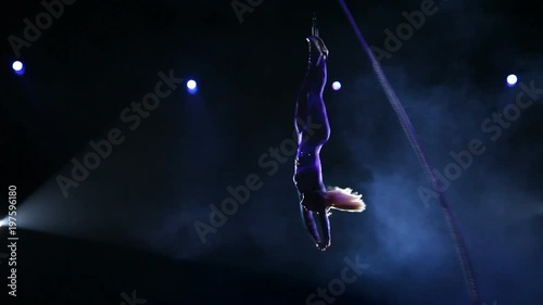 Acrobat with rope in circus