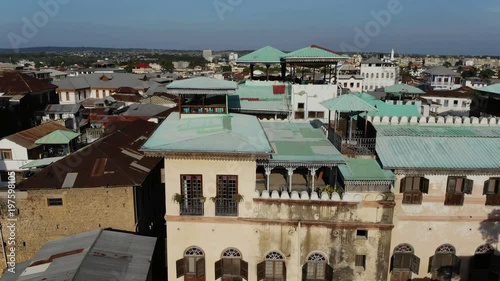 AERIAL view of the Stone Town, old part of Zanzibar City. Flight above main city of Zanzibar, Tanzania, Africa, Indian Ocean, 4k UHD photo