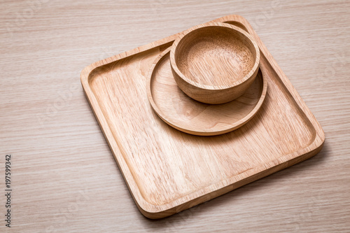 Wood dish on the wooden background.