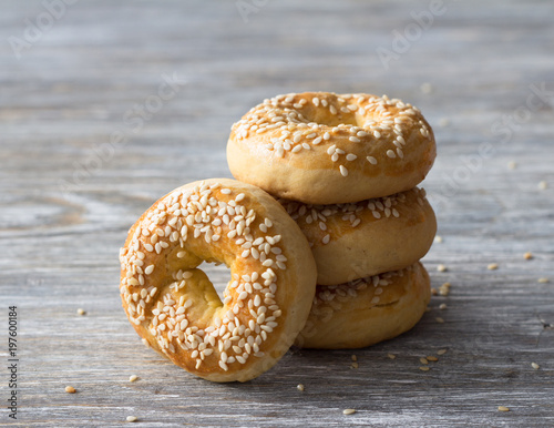 A stack of easter cookies with sesame seeds on a wooden table, selective focus. Traditional Greek Pastries photo