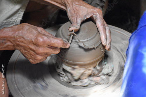 closeup on potter man hands shaping ceramic craft, ko kret island, Nonthaburi, Thailand