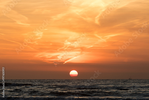 Fototapeta Naklejka Na Ścianę i Meble -  Scenic View Of Sea Against Orange Sky