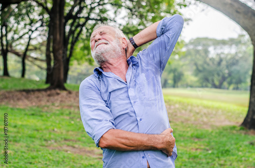 old age, health problem and people concept - senior man feeling sick at summer park