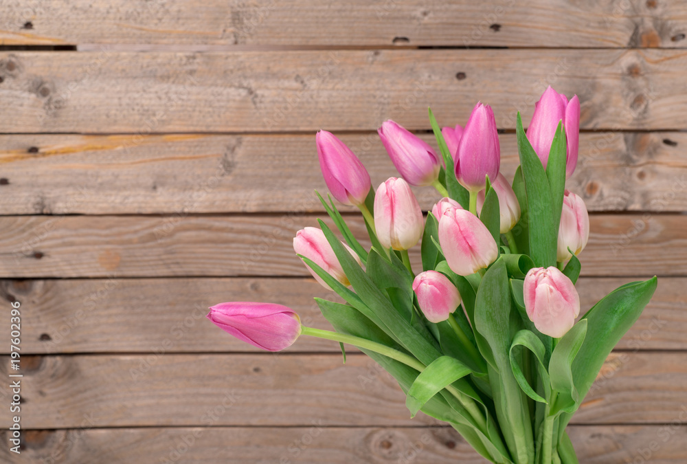 Tulips on the wooden background Tulips on the wooden background