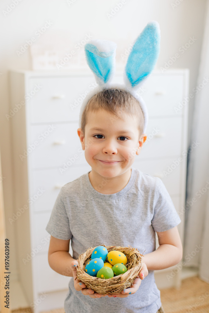 Fototapeta premium baby coloring and having fun with Easter eggs