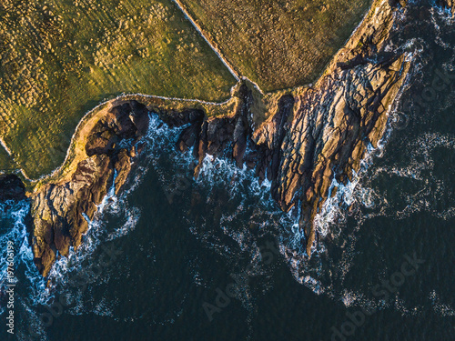 Cliffs in Ballinskelligs, County Kerry, Ireland photo