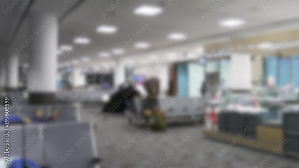 People sit late at night in the international airport out of focus People sit late at night in the international airport out of focus
