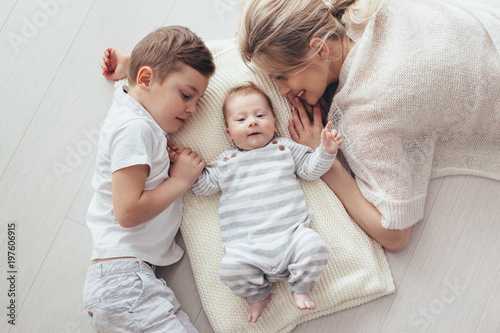 Mother playing with her 2 children