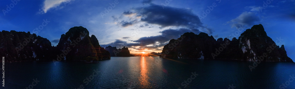 Aerial drone view of beautiful sunset over limestone rocks at the lake in Khao Sok National Park, Surat Thani, Thailand