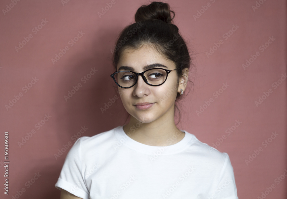 Cute Indian, Arab girl in glasses. Stock Photo | Adobe Stock