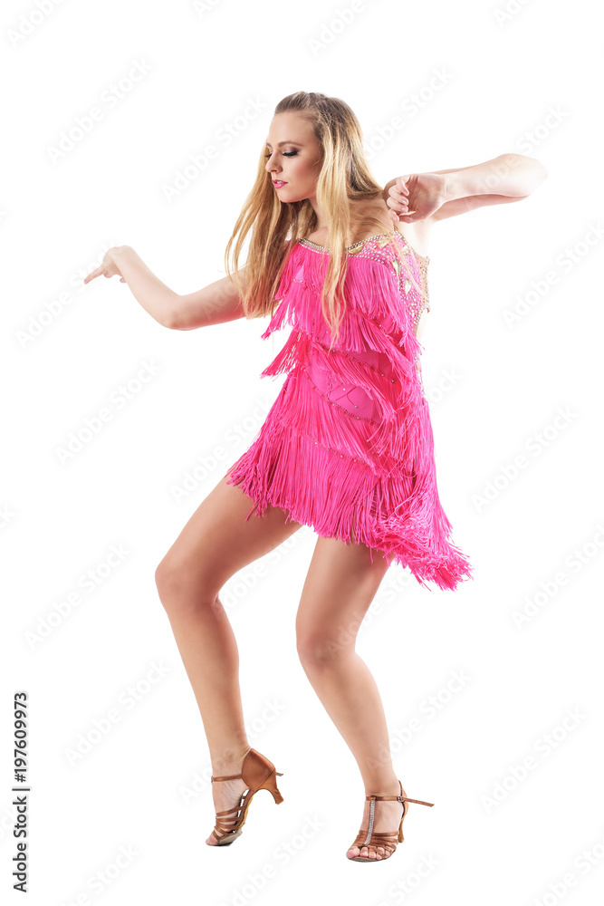 Side view of elegant feminine sensual blonde female dancing in fringed pink dress. Full body isolated on white background.
