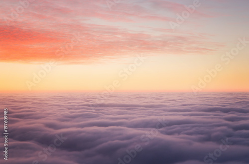 Sunset above the clouds with copy space