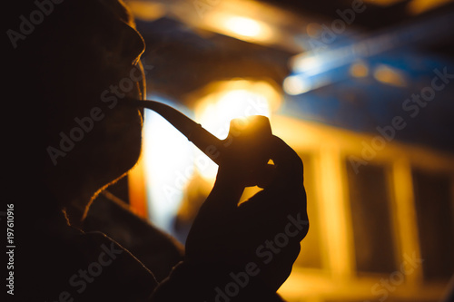 a man Smoking a pipe