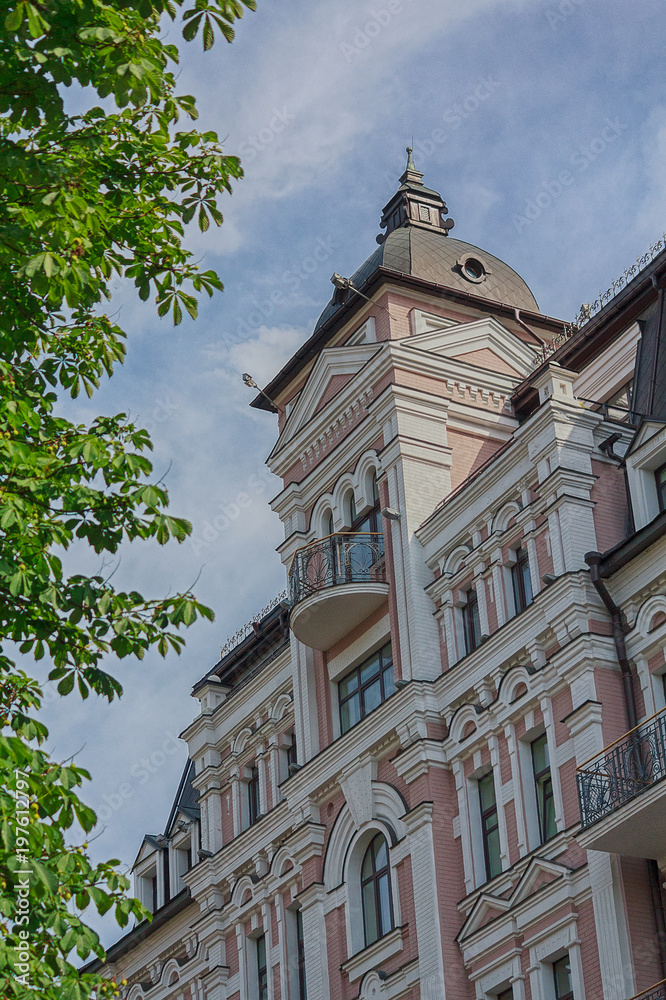 Facade of a beautiful house in a classical style. City Facade of a beautiful house in a classical style. City