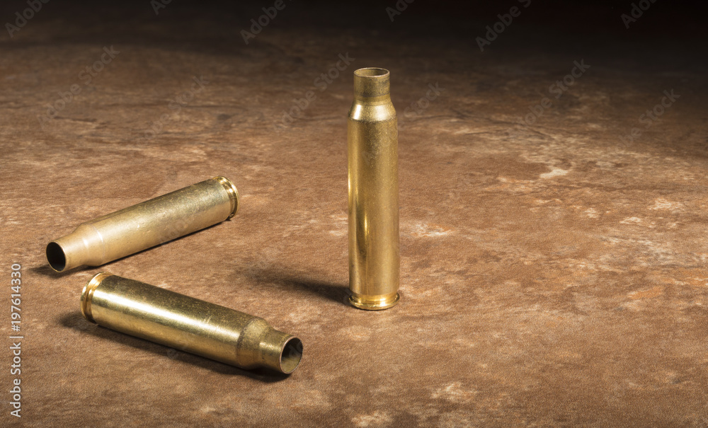 Trio of empty AR-15 cartridges on the floor Trio of empty AR-15 cartridges on the floor