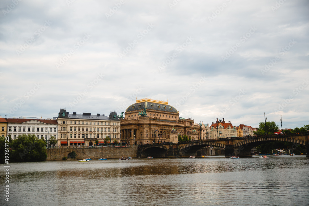 PRAGUE,CZECH REPUBLIC - JUNE 23, 2017: Charles bridge on Vltava river and old buildings in Prague, Czech Republic