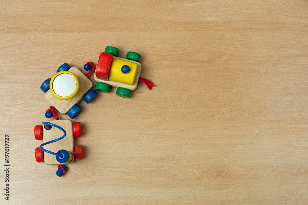 Obraz premium Wooden train toy on floor.