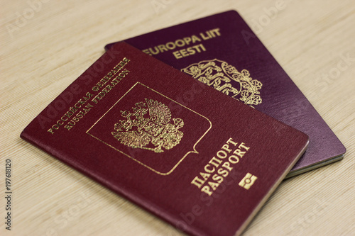 two passports on the table. dual citizenship of Estonia and russia, europe