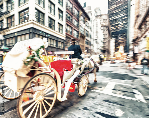 Fast moving horse carriage in city center. Holiday and tourism concept