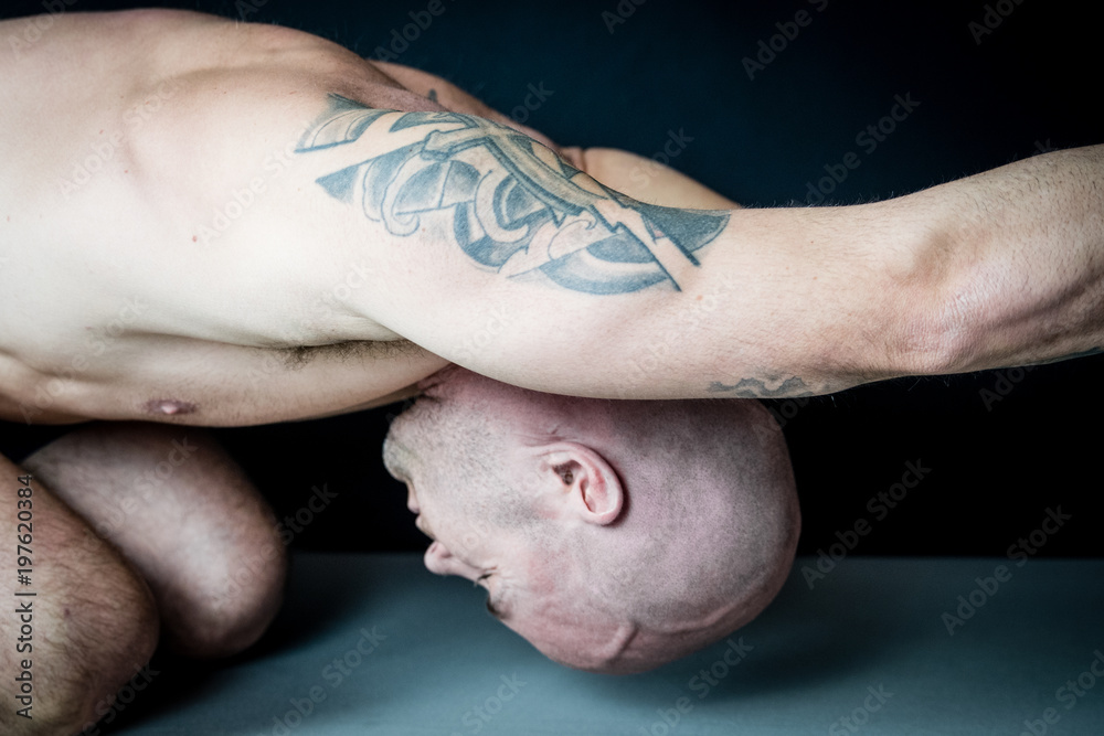 Naklejka premium Muscular man performs Yoga and meditation