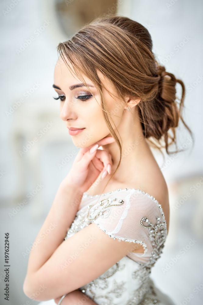 Fashionable model Bride.Young with perfect skin and make-up, white background