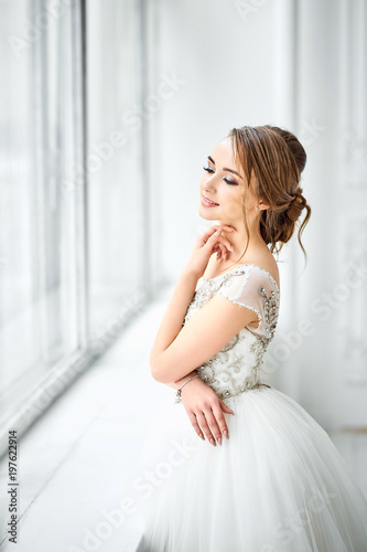 Young bride in wedding dress, studio shot