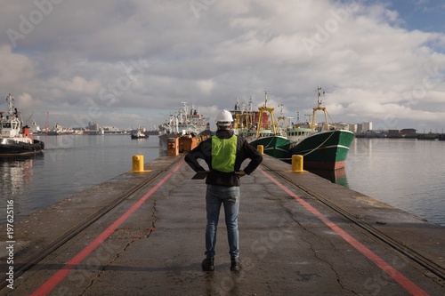 Dock worker standing in the port photo