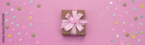 Banner Decorative holiday gift boxes with pink color on pink background.