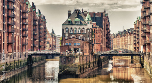 HAMBURG, GERMANY - JULY 20, 2016: Famous water castle in Speicherstadt. Hamburg attracts 10 million people annually photo